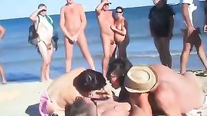 Safari A foursome on the beach while the lookers-on stroke their cocks NSFW