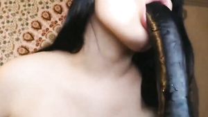 xBabe Dark Haired Cam Chic Slobbers On A Long Black Dong Tranny Sex