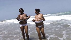 Blowjob Big boobed black chicks are fondling each other by the ocean AsianFever